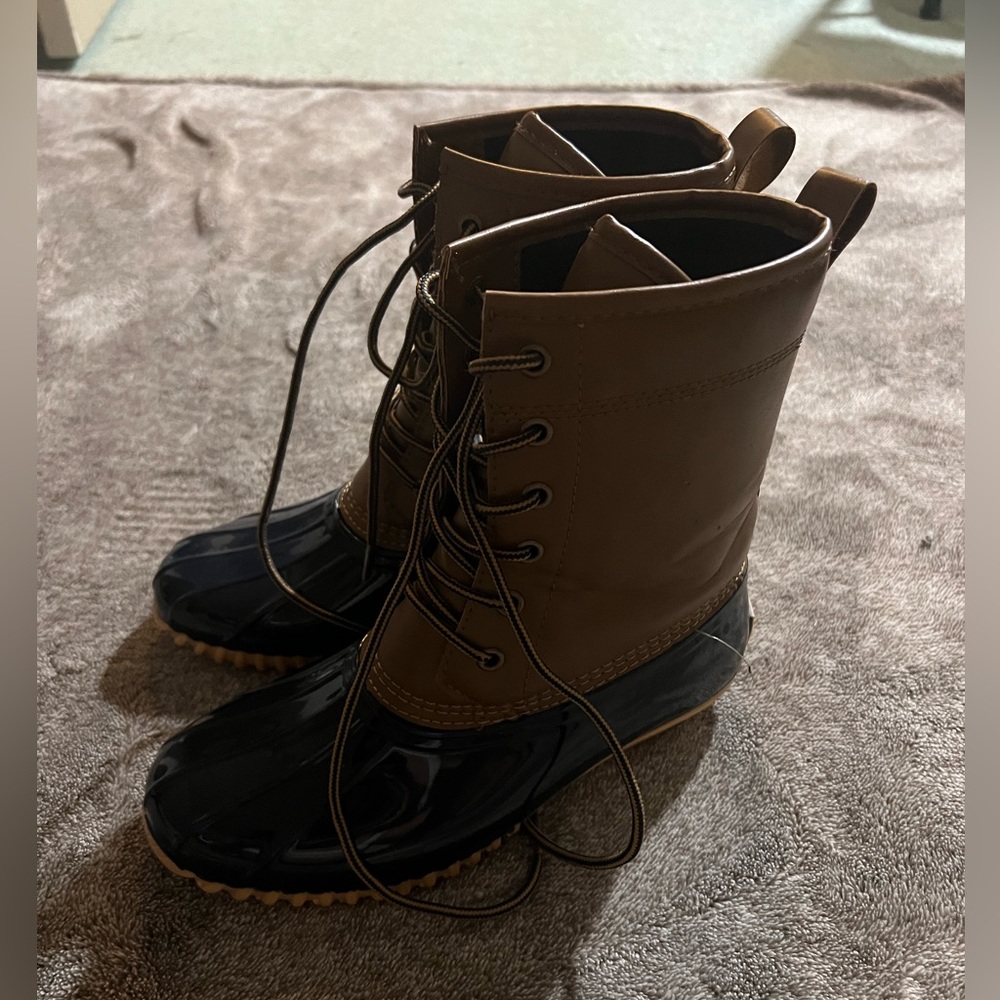 Brown and blue water proof boots
